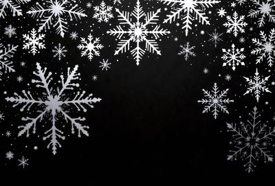 The primary subject of the image is a snowflake pattern, which is displayed on a black background. The setting is a dark room, and the visual style is a combination of a photo and digital art. The dominant colors are white and black, creating a contrasting and visually striking scene.